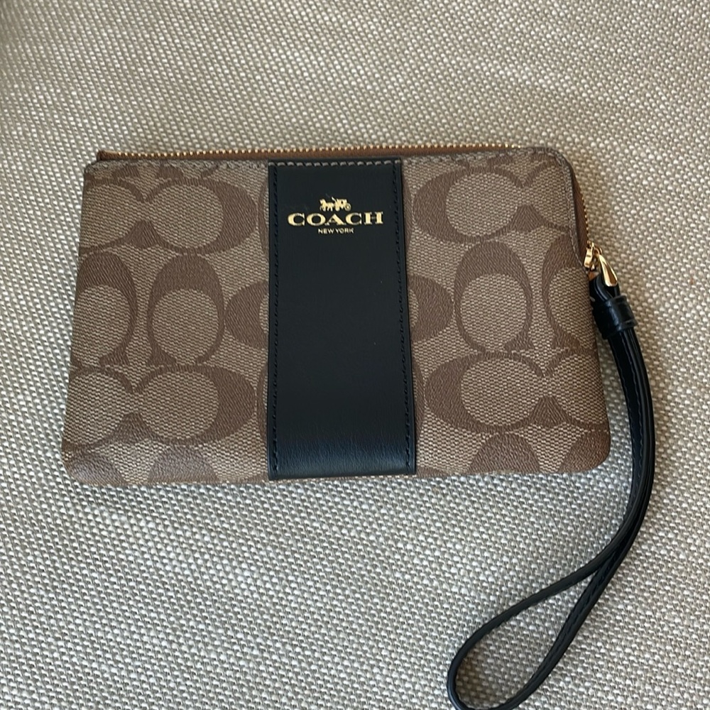 Coach wallet with wrist strap.